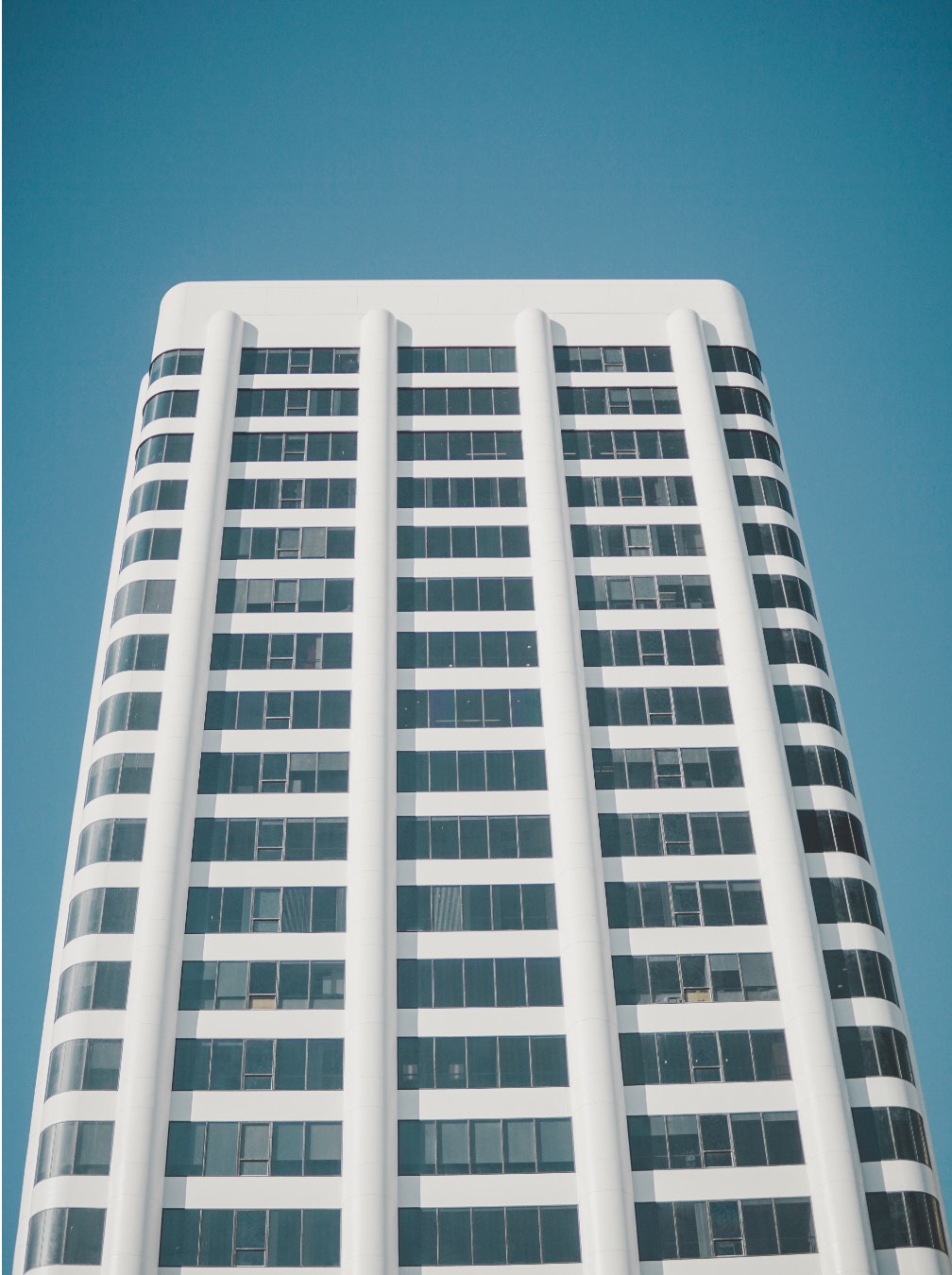 Looking up at office building