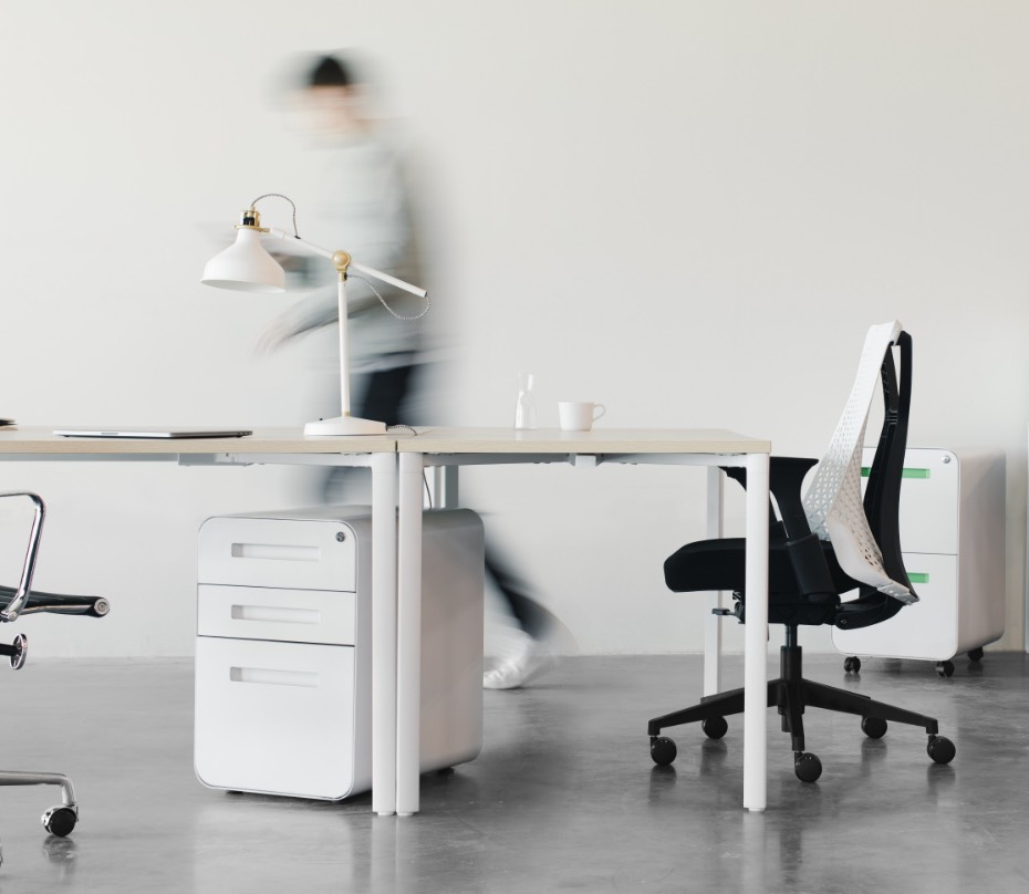 Person walking by desk