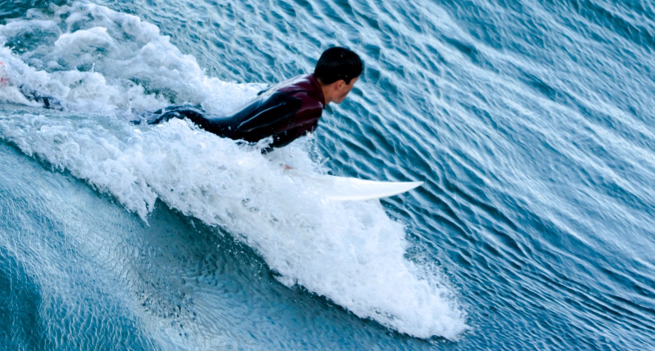 Surfer riding wave