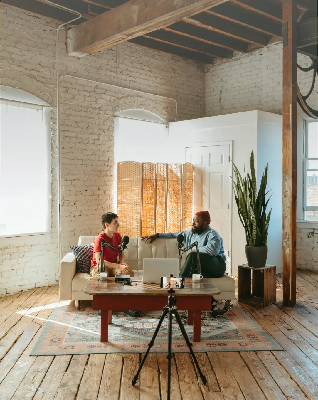 Photo of two people talking on coach